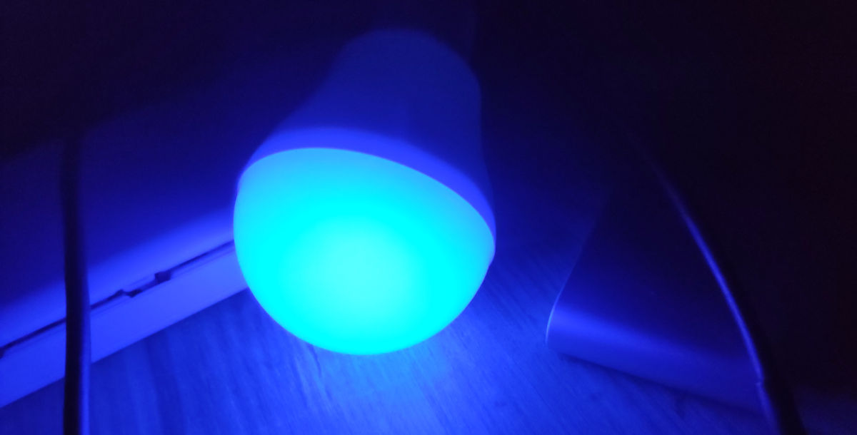 The bulb glowing blue while charging